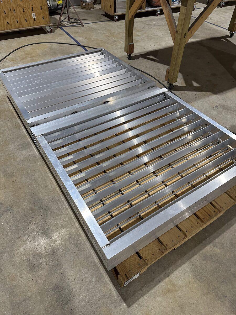 Louvered aluminum equipment screen panel under fabrication in the CG Signs Orange Park shop — for Latitude Margaritaville Watersound